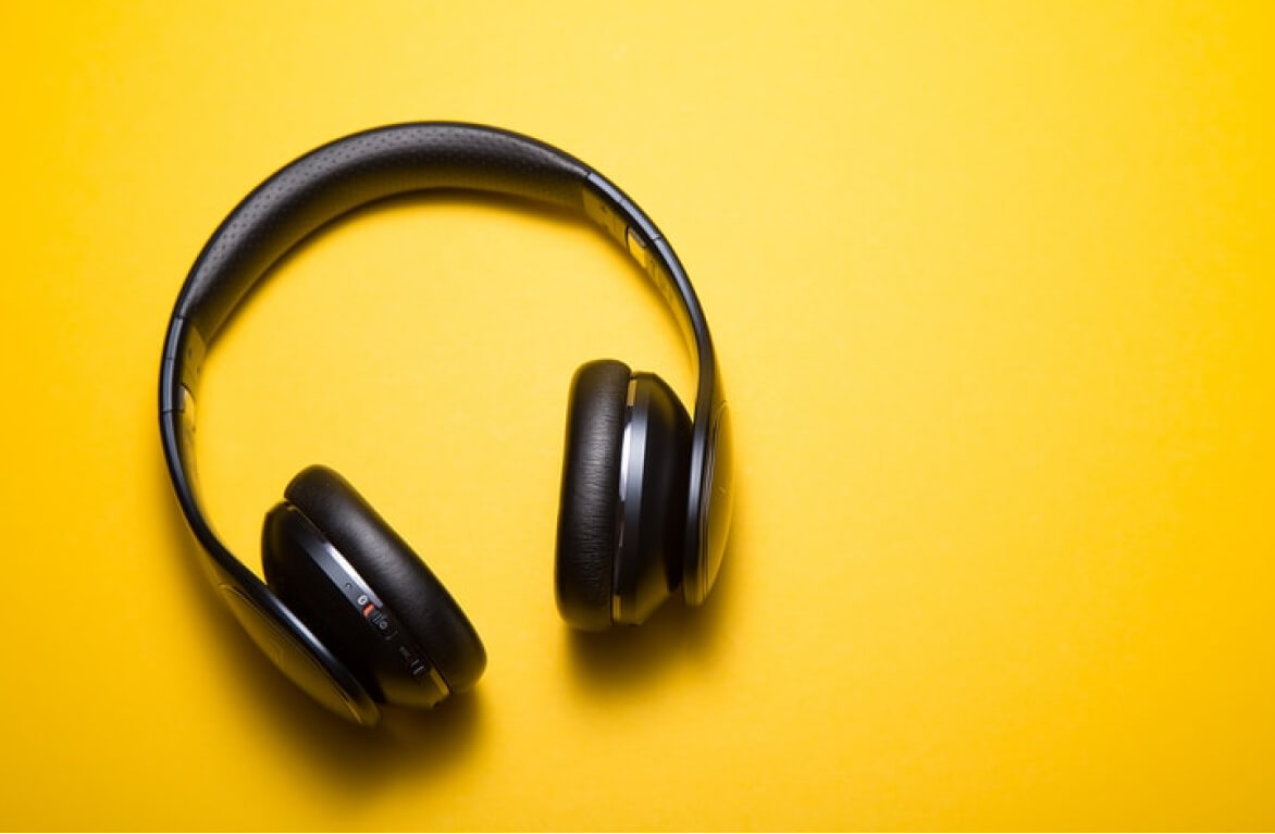 Top view of headphones against yellow background